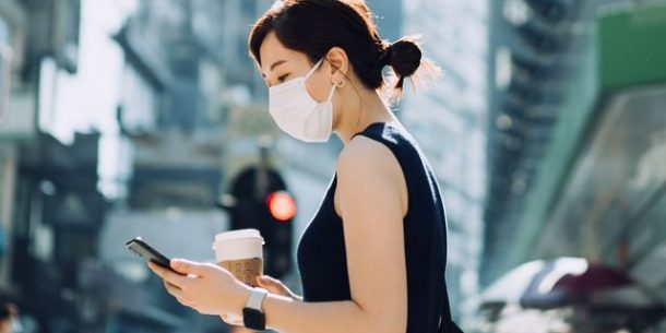 young asian woman with protective face mask holding royalty free image 1620802456