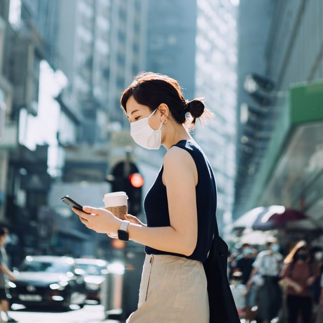 young asian woman with protective face mask holding royalty free image 1620802456